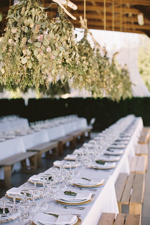 White themed table setting in the backyard