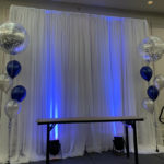28-Clarion - white backdrop/uplights and balloons